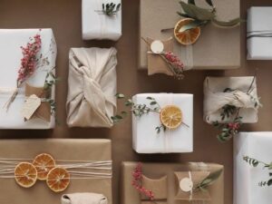 Gift Wrapping Process In Recycled Paper Gift Boxes Skein Of Twine